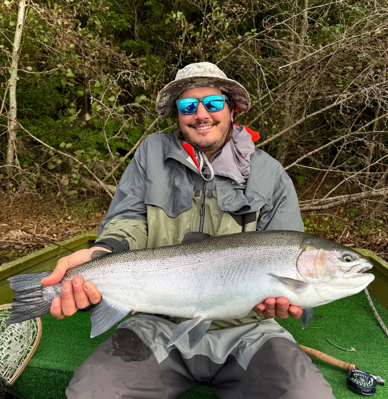 Marcos Quiroz with fly fishing gear and a real catch in the boat